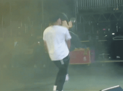 Man In White Shirt And Black Pants Dancing On Stage GIF