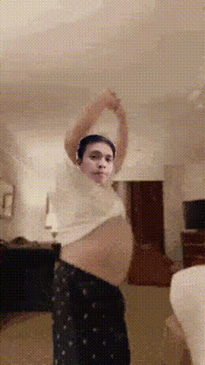 Man In White Shirt And Black Pants Stretching Arms GIF