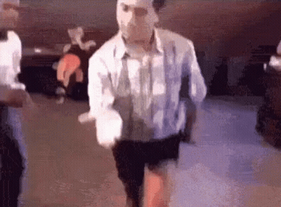 Man In White Shirt And Black Shorts Dancing GIF