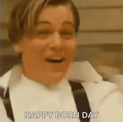 Man In White Shirt And Black Suspenders Says Happy Born Day GIF