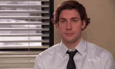 Man In White Shirt And Black Tie At Window GIF