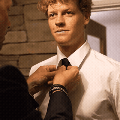 Man In White Shirt And Black Tie Helped By Another GIF