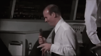 Man In White Shirt And Black Tie Holding Microphone GIF