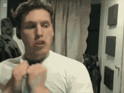 Man In White Shirt And Black Tie Looking In Mirror GIF