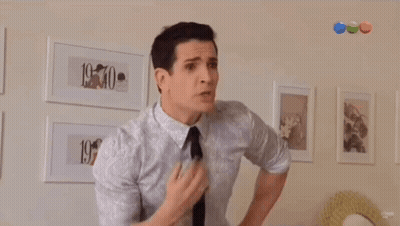 Man In White Shirt And Black Tie Says Vos Sos Tarada GIF