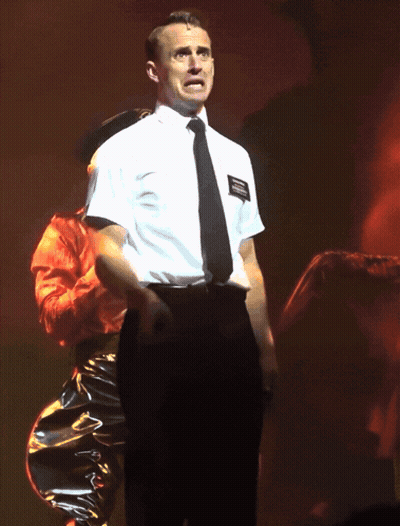 Man In White Shirt And Black Tie With Name Tag Joseph Smith GIF