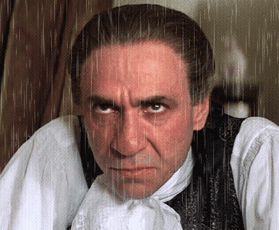 Man In White Shirt And Black Vest With Rain Drops GIF