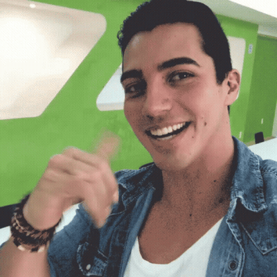 Man In White Shirt And Blue Denim Jacket Smiling GIF