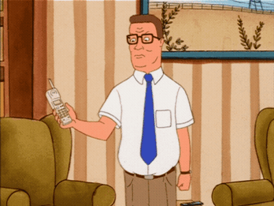 Man In White Shirt And Blue Tie Holding Cellphone GIF