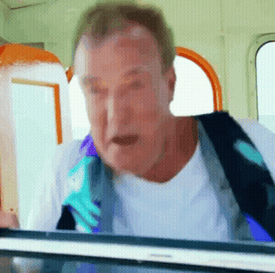 Man In White Shirt And Blue Tie Looking Out Window GIF