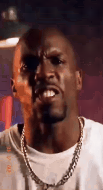 Man In White Shirt And Gold Chain Making Face GIF