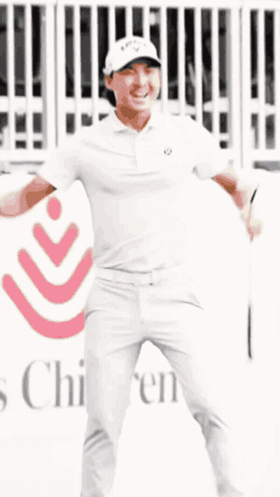 Man In White Shirt And Pants In Front Of Children's Hospital Sign GIF