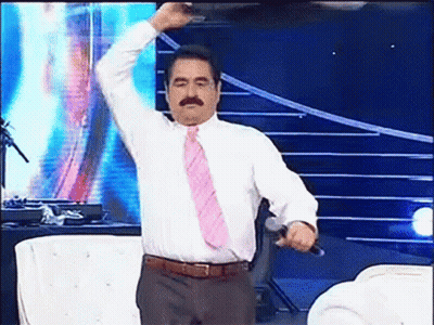 Man In White Shirt And Pink Tie Holding Microphone GIF