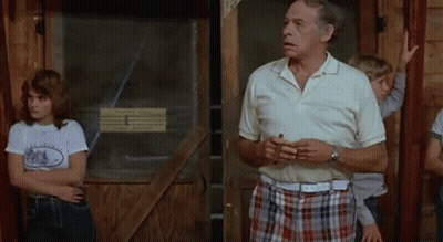 Man In White Shirt And Plaid Shorts GIF