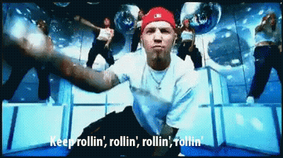 Man In White Shirt And Red Hat Saying Keep Rollin GIF