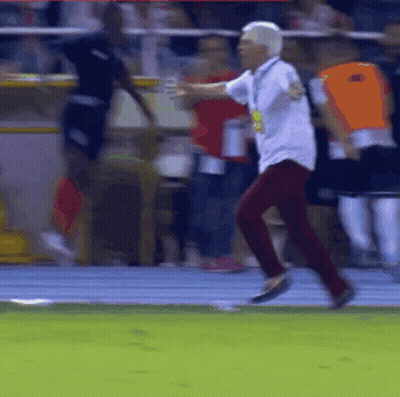 Man In White Shirt And Red Pants Running On Track GIF