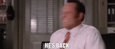 Man In White Shirt And Red Tie Saying He's Back GIF