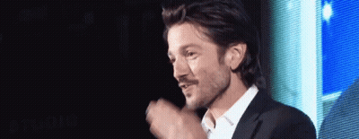 Man In White Shirt And Suit Before Screen GIF