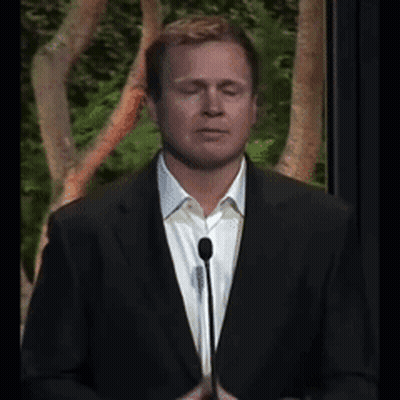 Man In White Shirt And Suit Eyes Closed At Microphone GIF