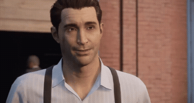 Man In White Shirt And Suspenders Smiling In Front Of Brick Wall GIF