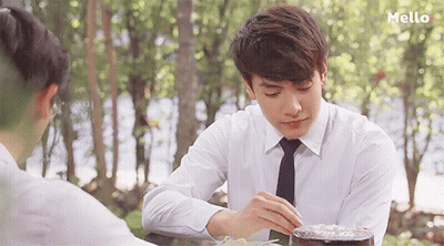 Man In White Shirt And Tie At Table GIF