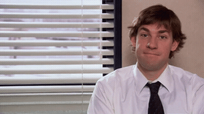 Man In White Shirt And Tie By Window With Blinds GIF