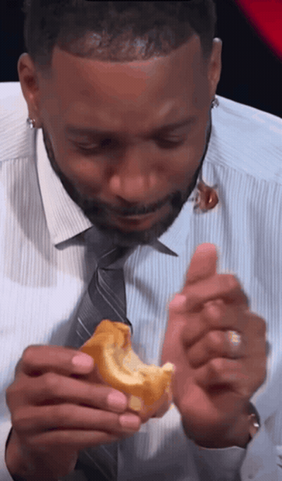Man In White Shirt And Tie Eating Sandwich GIF