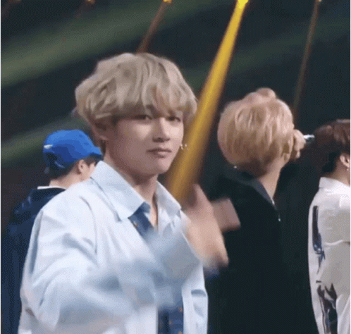 Man In White Shirt And Tie In Crowd GIF