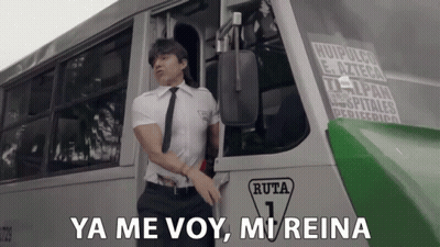 Man In White Shirt And Tie In Front Of Bus Saying Ruta 1 GIF