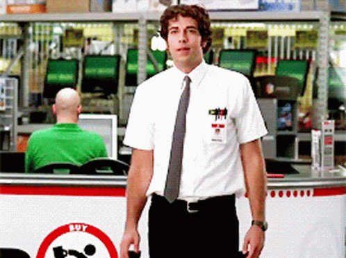 Man In White Shirt And Tie In Front Of Buy Sign GIF