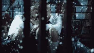 Man In White Shirt And Tie In Prison Cell GIF