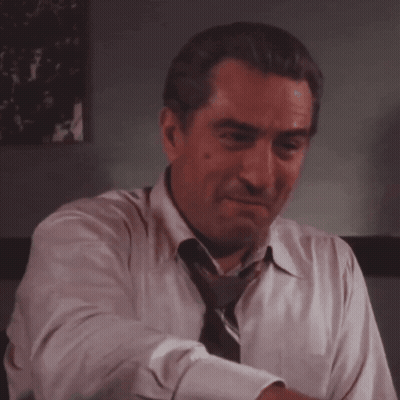 Man In White Shirt And Tie Laughing GIF