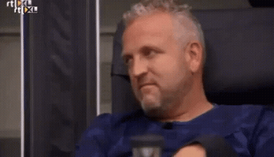 Man In White Shirt And Tie Laughing In Chair GIF