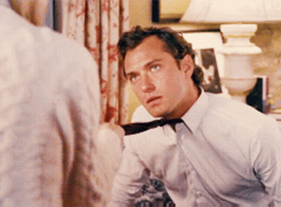 Man In White Shirt And Tie Looking GIF
