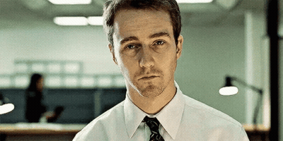 Man In White Shirt And Tie Looking At Camera GIF