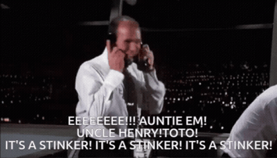 Man In White Shirt And Tie On Phone Saying It's A Stinker GIF