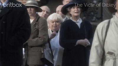 Man In White Shirt And Tie Pointing Gun GIF