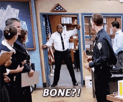 Man In White Shirt And Tie Saying Bone In Doorway GIF