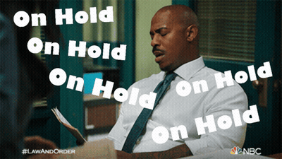 Man In White Shirt And Tie Saying On Hold GIF