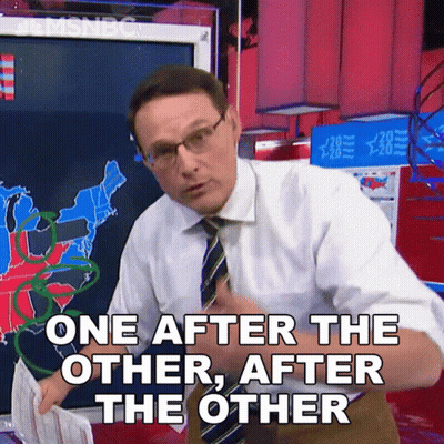 Man In White Shirt And Tie Saying One After The Other GIF