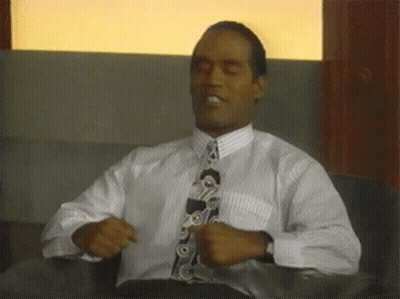 Man In White Shirt And Tie Sitting GIF