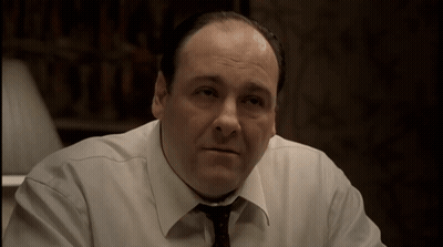 Man In White Shirt And Tie Sitting GIF