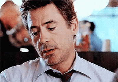 Man In White Shirt And Tie Smoking Cigarette GIF