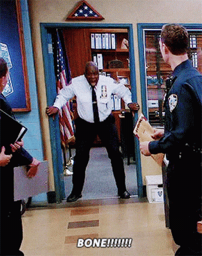 Man In White Shirt And Tie Standing In Doorway Saying Bone GIF