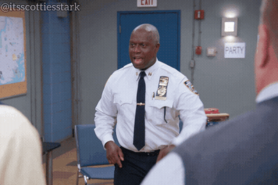 Man In White Shirt And Tie Standing In Front Of Party Sign GIF