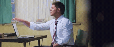 Man In White Shirt And Tie Using Laptop GIF