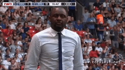 Man In White Shirt And Tie Watching Game On TSN GIF