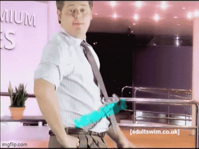 Man In White Shirt And Tie With Adultswim.co.uk Sign GIF