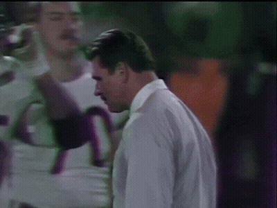 Man In White Shirt And Tie With Football Players 75 GIF