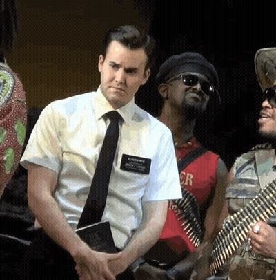 Man In White Shirt And Tie With Name Tag Elijah Price GIF